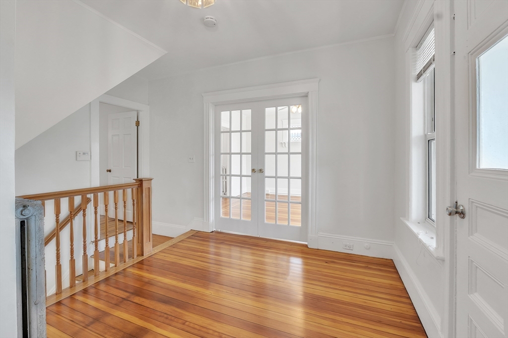 31 Justin Road, Unit 3 Boston, MA 02135 - Photo 18 of 32 a view of a room with wooden floor and windows