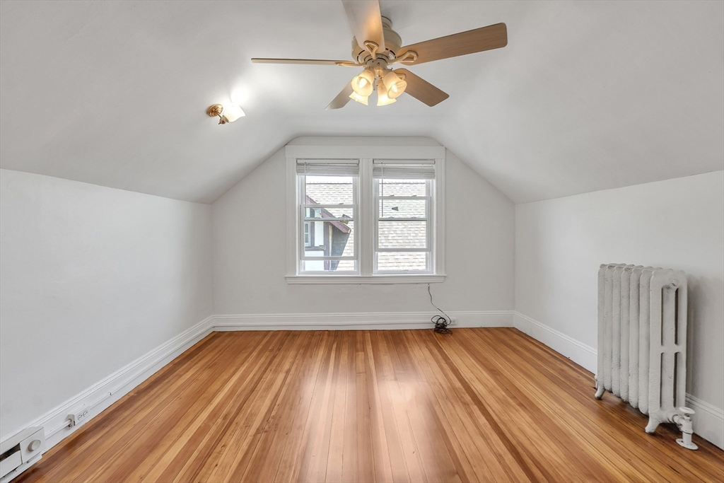 31 Justin Road, Unit 3 Boston, MA 02135 - Photo 25 of 32 wooden floor in an empty room with a window