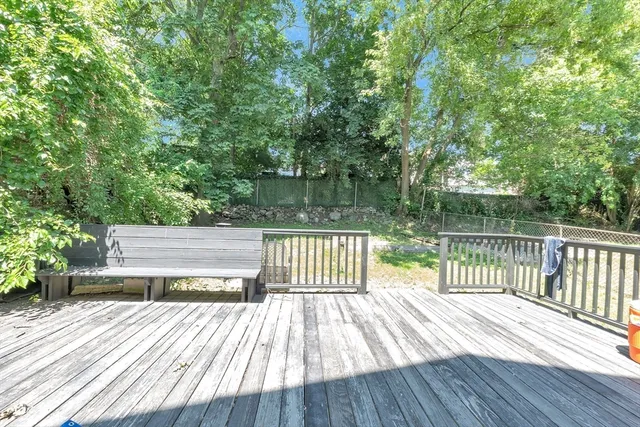a view of deck with wooden floor and fence