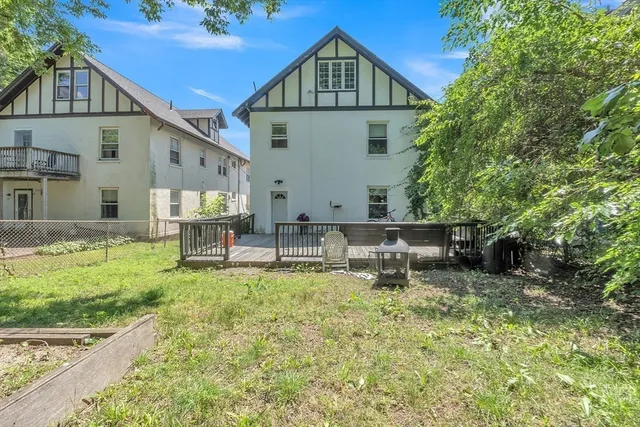 a view of an house with backyard porch and sitting area