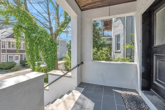 a view of a balcony with wooden floor and outdoor space