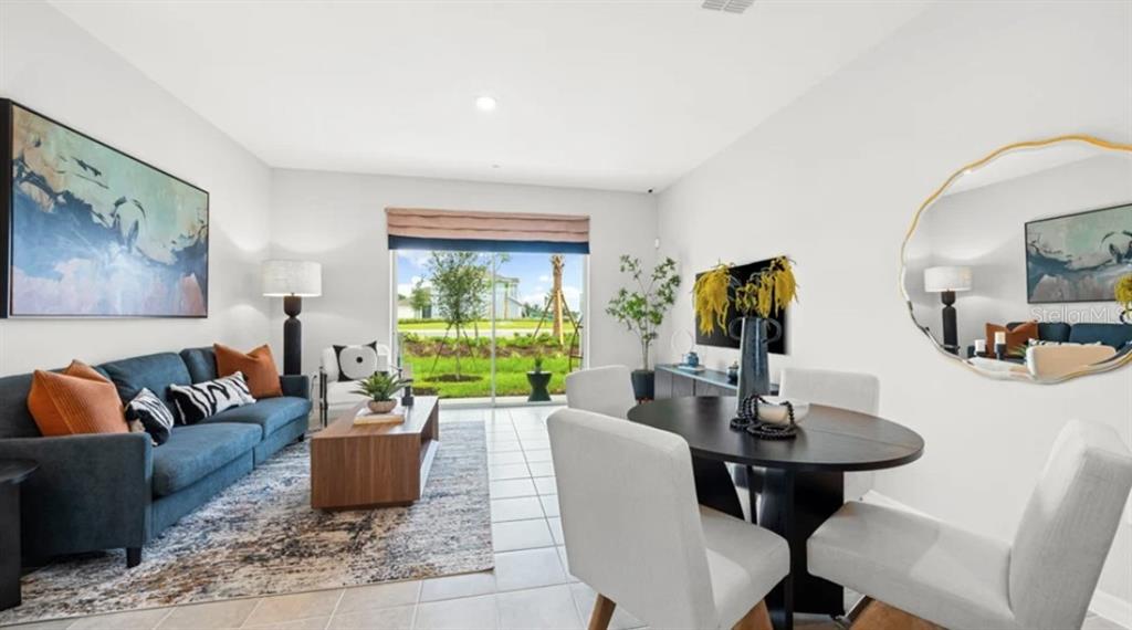 14060 Textile Run Parrish, FL 34219 - Photo 8 of 23 a living room with furniture and a large window