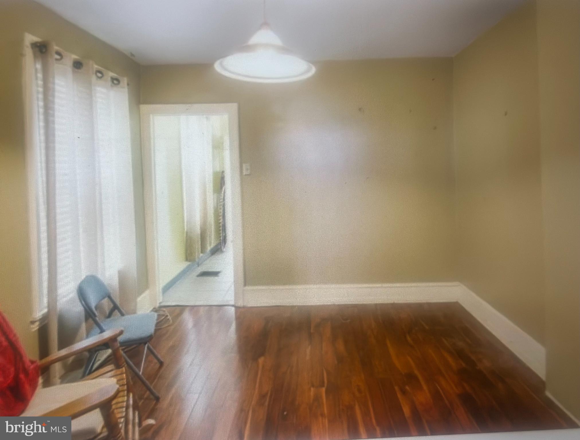 1925 North 23rd Street Philadelphia, PA 19121 - Photo 4 of 11 a view of wooden floor and chair in a room