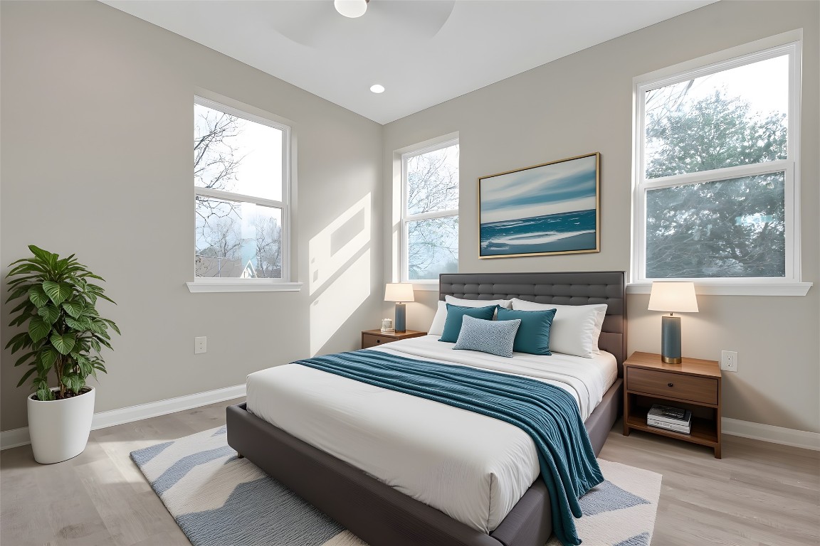 4913 Single Shot Circle, Unit B Austin, TX 78723 - Photo 11 of 21 a bedroom with a large bed and a potted plant