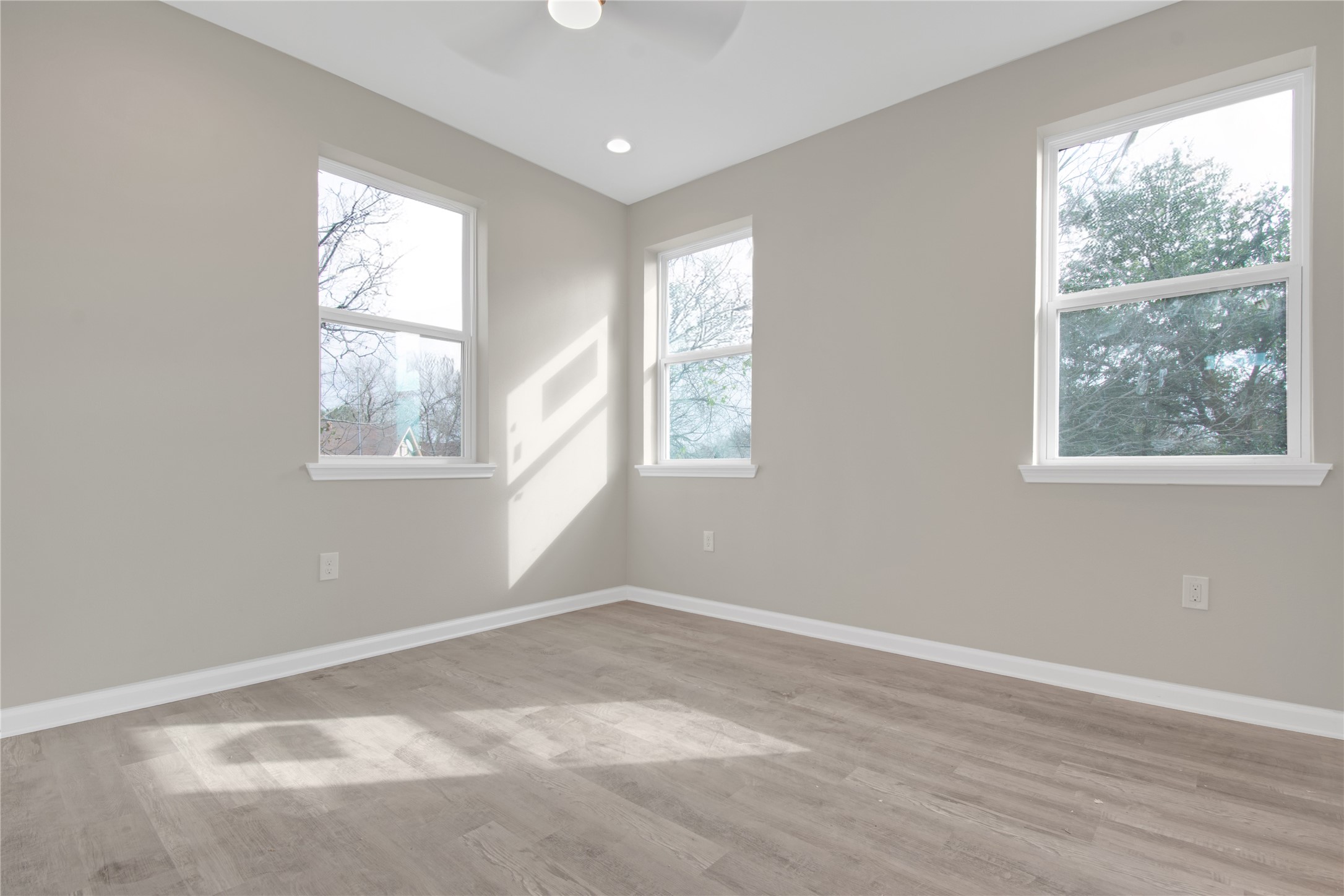 4913 Single Shot Circle, Unit B Austin, TX 78723 - Photo 12 of 21 an empty room with wooden floor and windows