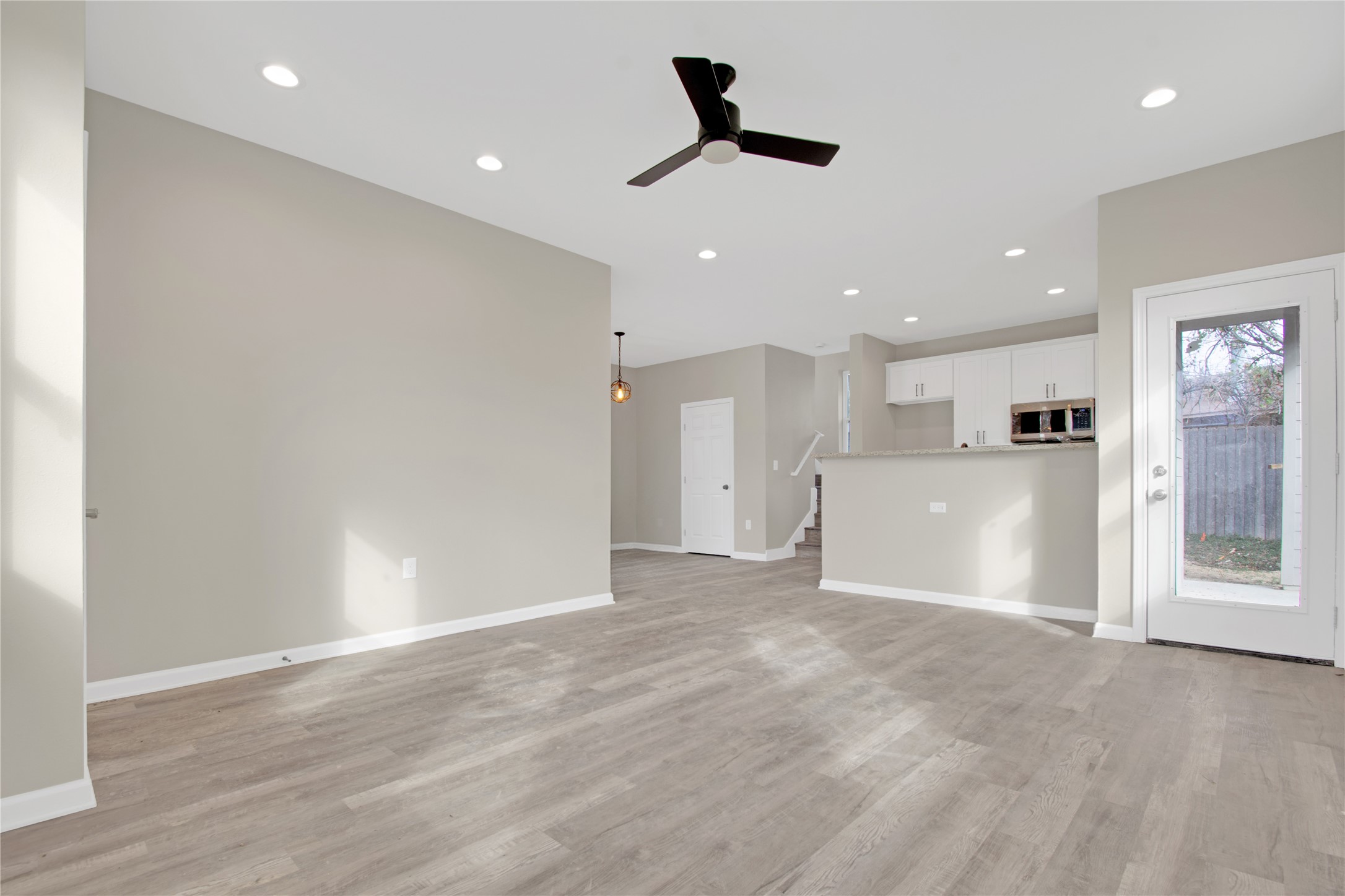 4913 Single Shot Circle, Unit B Austin, TX 78723 - Photo 7 of 21 a view of a kitchen with a sink and a refrigerator