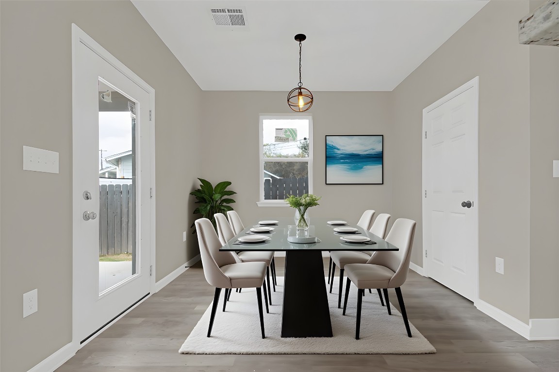 4913 Single Shot Circle, Unit B Austin, TX 78723 - Photo 9 of 21 a view of a dining room with furniture window and wooden floor