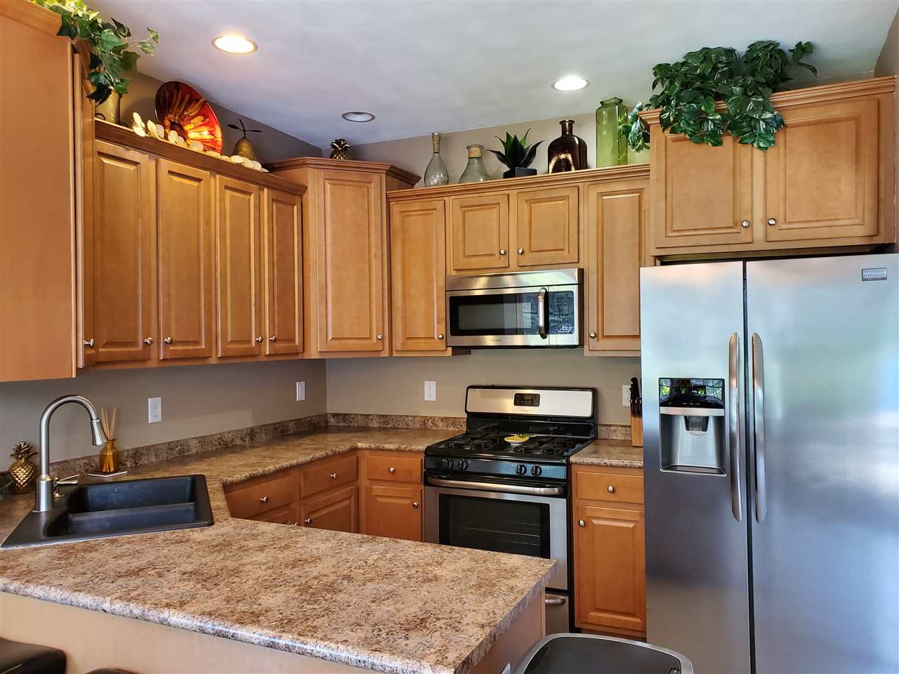 2850 Southbridge Road Rockford, IL 61114 - Photo 6 of 25 a kitchen with stainless steel appliances granite countertop a refrigerator sink and cabinets