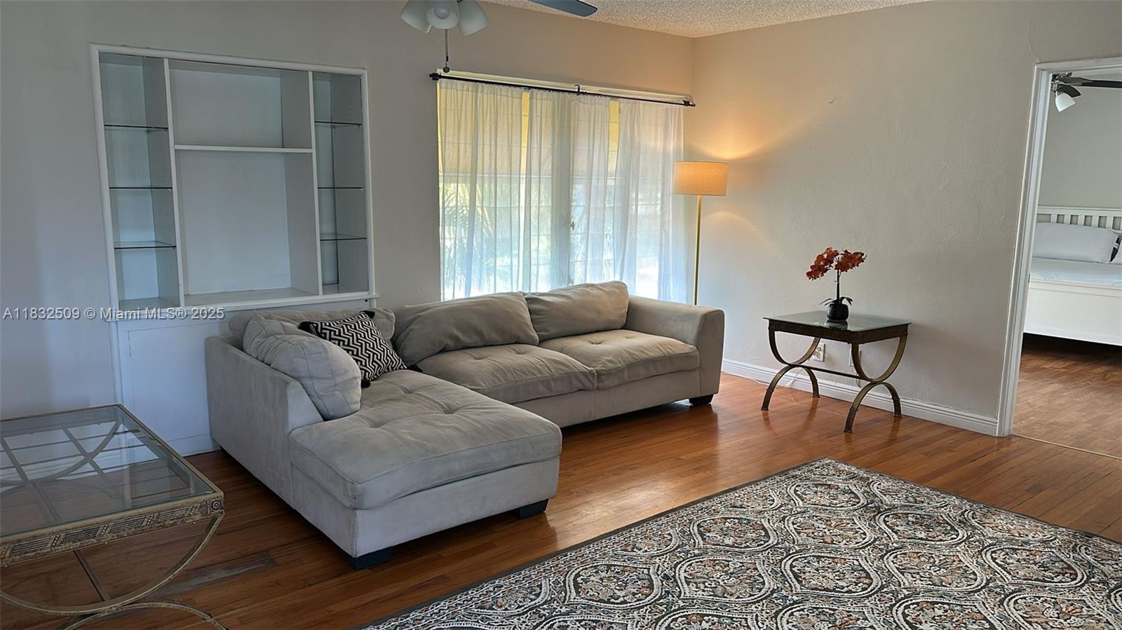 a living room with furniture and a window