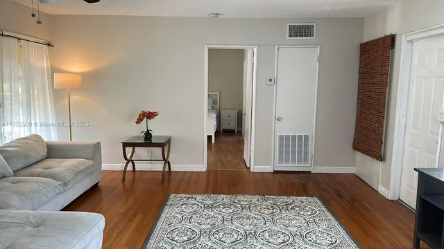 a living room with furniture and a rug