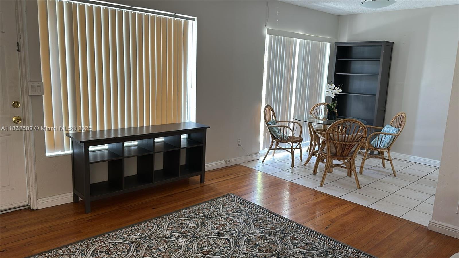 90 Isle Of Venice Drive, Unit 9 Fort Lauderdale, FL 33301 - Photo 3 of 7 a dining room with furniture and wooden floor