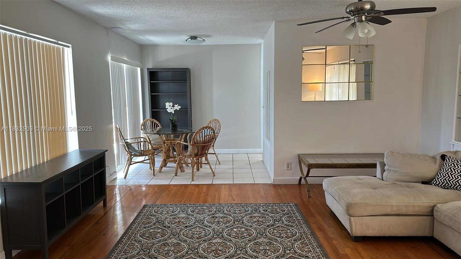 90 Isle Of Venice Drive, Unit 9 Fort Lauderdale, FL 33301 - Photo 5 of 7 a living room with furniture and a window
