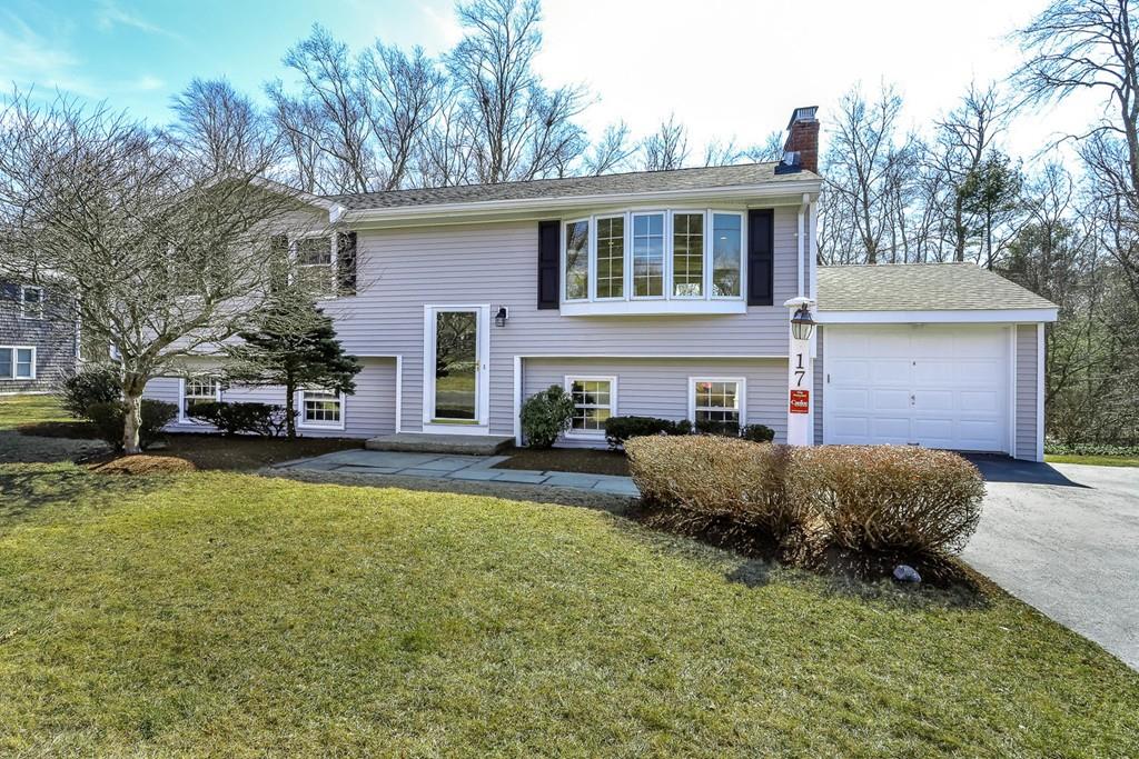 17 Longmeadow Road Medfield, MA 02052 - Photo 1 of 18 a front view of a house with a yard and garage