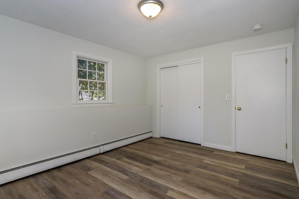 17 Longmeadow Road Medfield, MA 02052 - Photo 13 of 18 a view of empty room with wooden floor and fan