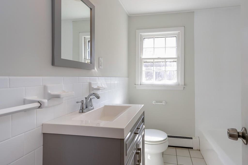 17 Longmeadow Road Medfield, MA 02052 - Photo 14 of 18 a bathroom with a sink toilet and a mirror
