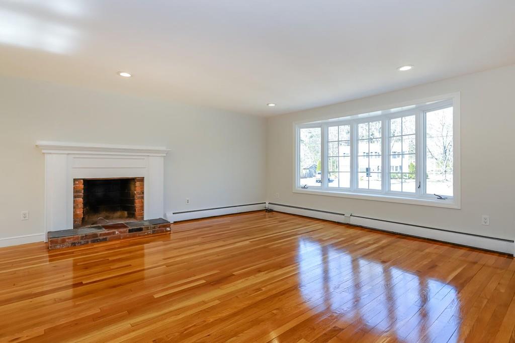 17 Longmeadow Road Medfield, MA 02052 - Photo 2 of 18 a view of an empty room with wooden floor and a window