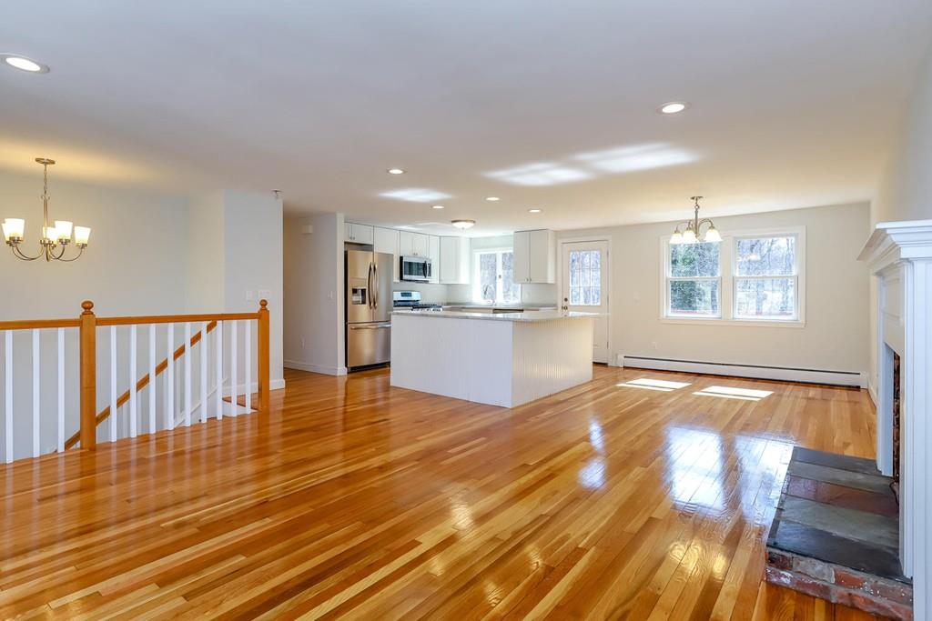 17 Longmeadow Road Medfield, MA 02052 - Photo 3 of 18 a view of a living room a stove and wooden floor