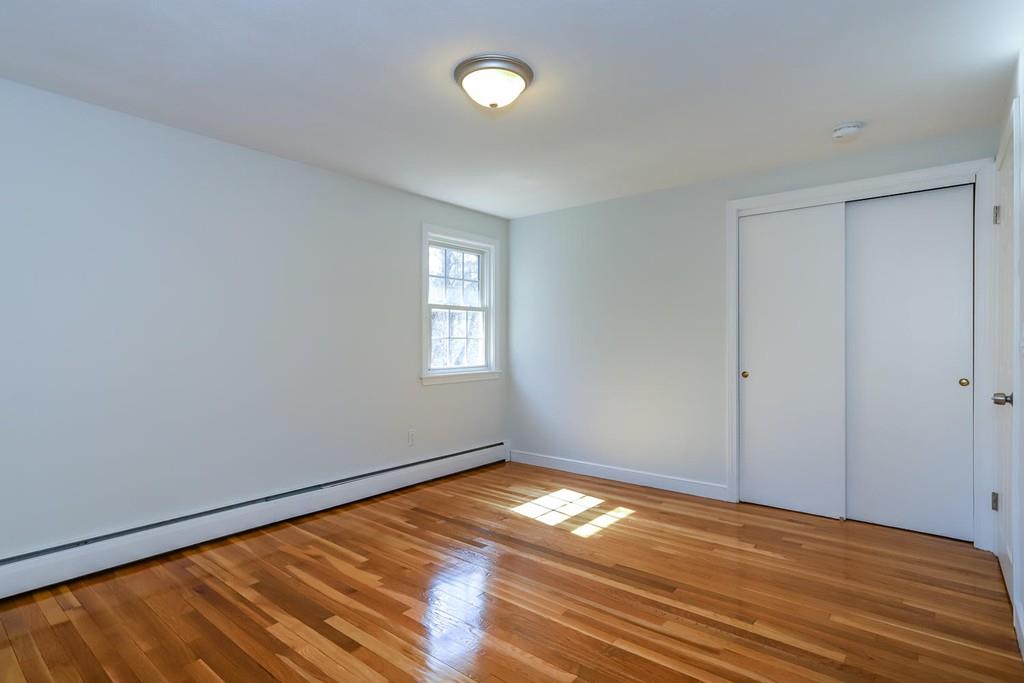 17 Longmeadow Road Medfield, MA 02052 - Photo 7 of 18 a view of empty room with wooden floor and fan