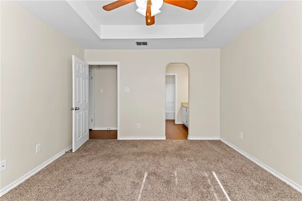 a view of a room with wooden floor and window