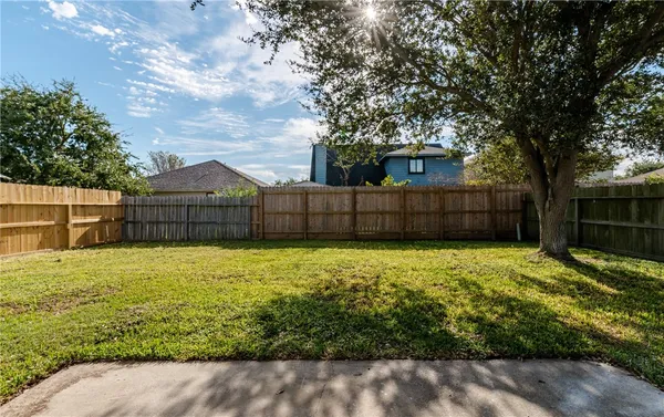 a view of backyard with green space