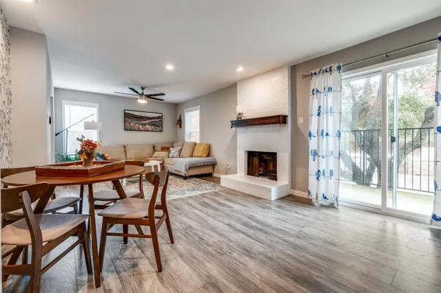 a view of a livingroom with furniture window and wooden floor