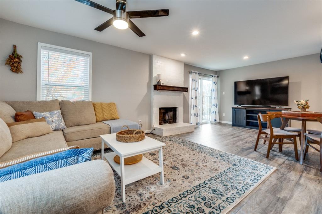 6900 Skillman Street, Unit 109 Dallas, TX 75231 - Photo 11 of 21 a living room with furniture and a flat screen tv