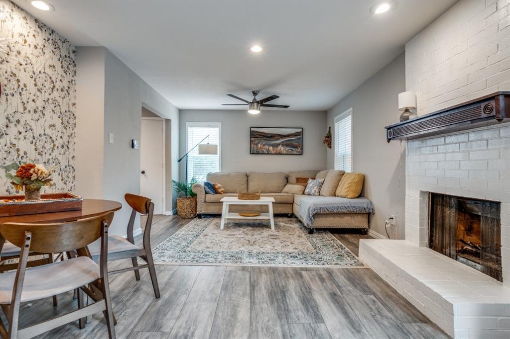 6900 Skillman Street, Unit 109 Dallas, TX 75231 - Photo 13 of 21 a living room with furniture and a fireplace