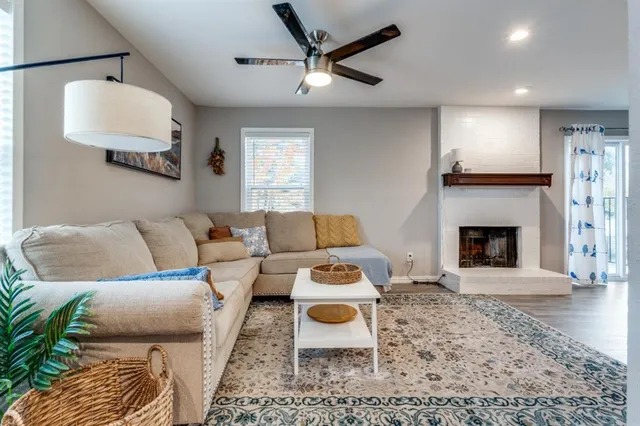 a living room with furniture and a fireplace