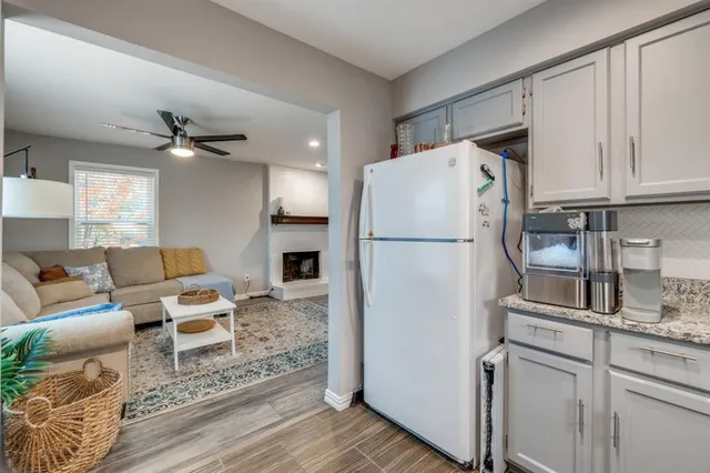 a kitchen with stainless steel appliances a refrigerator sink and cabinets
