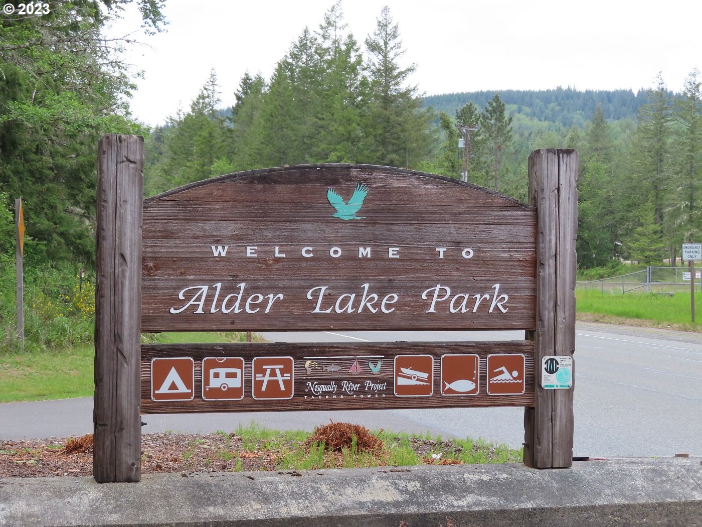 Pilgrim Road East Eatonville, WA 98328 - Photo 30 of 34 a view of street sign on a sidewalk next to a road
