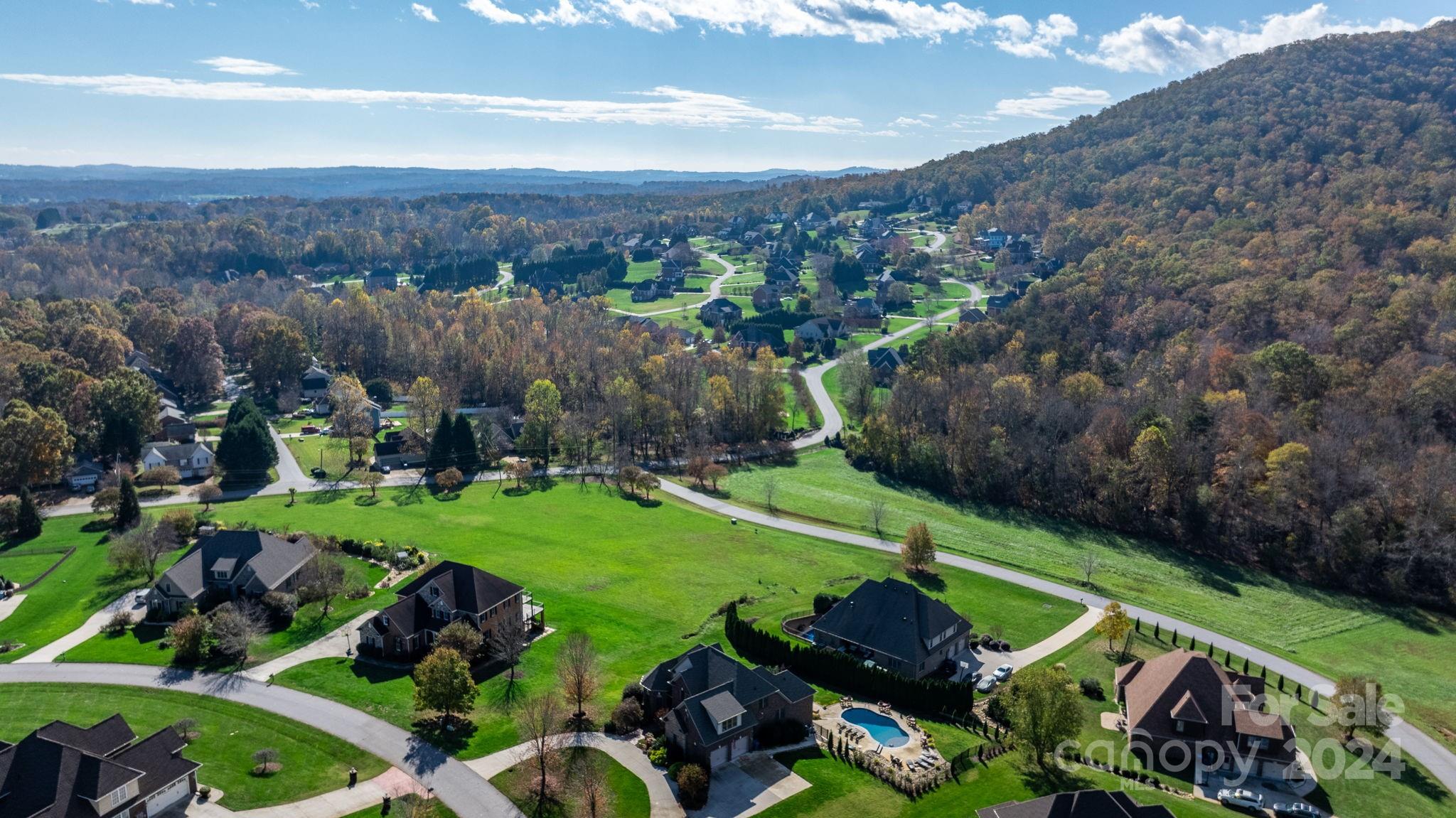 a view of a garden with a building in the background