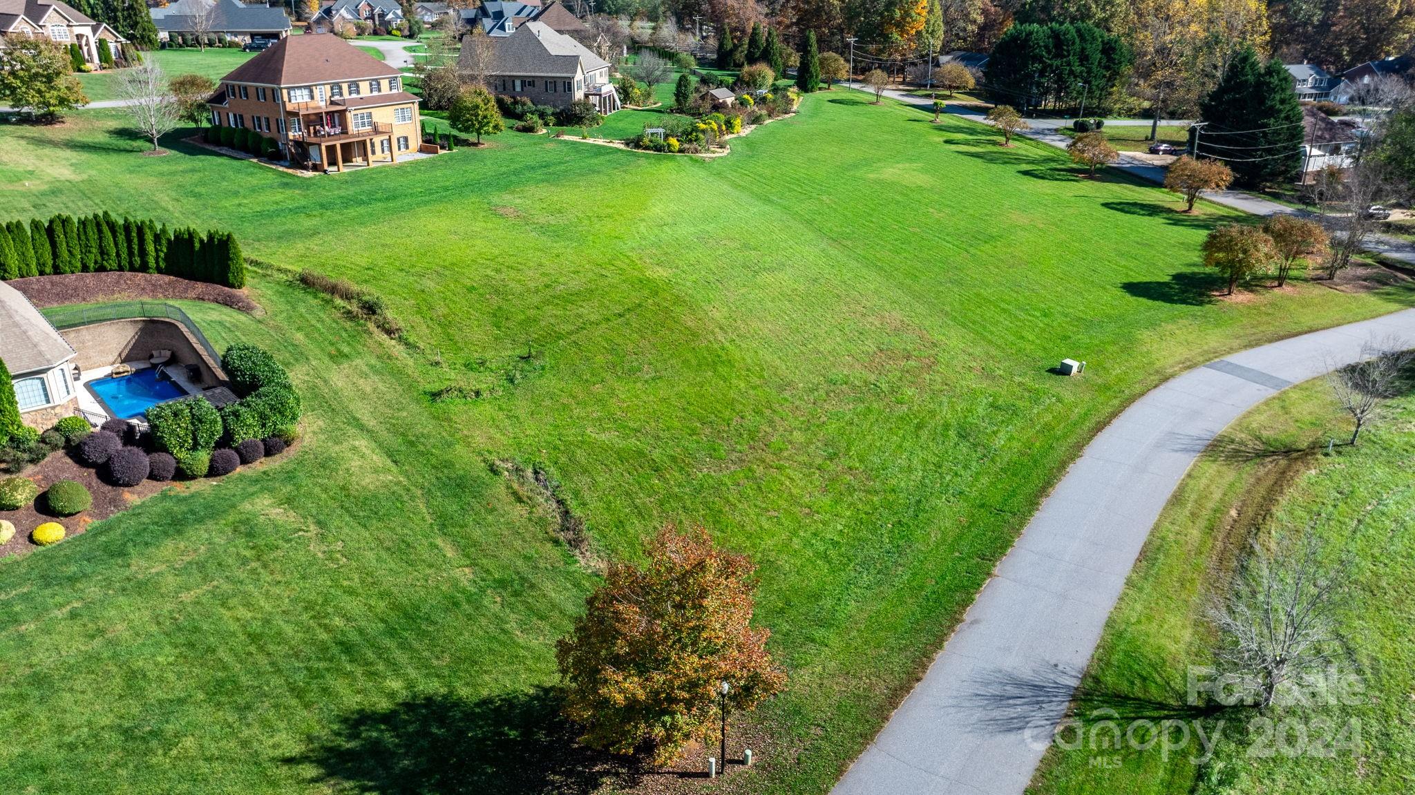 5944 Bakers Point Hickory, NC 28602 - Photo 15 of 22 a view of a garden with a building in the background