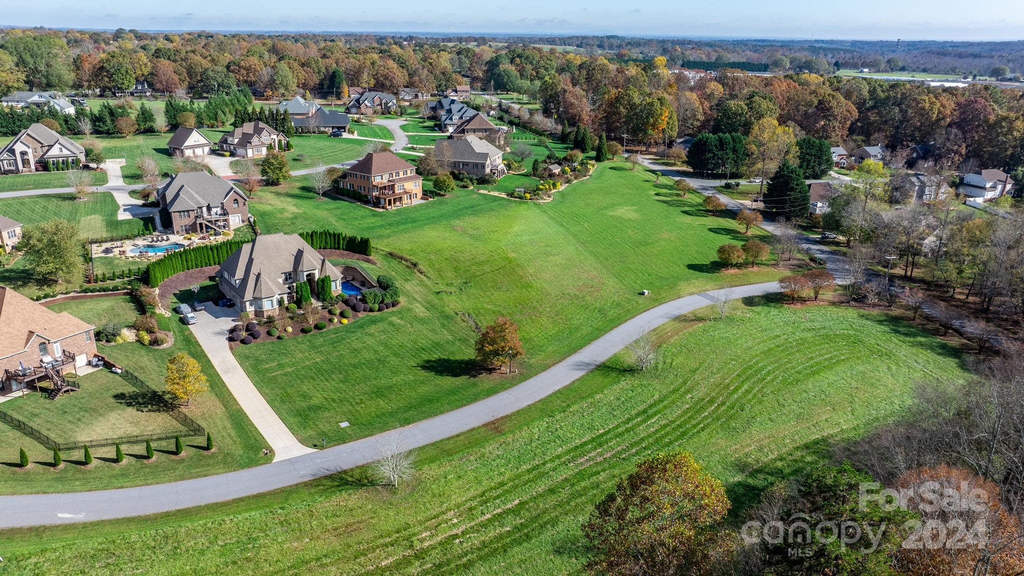 5944 Bakers Point Hickory, NC 28602 - Photo 19 of 22 an aerial view of residential houses with outdoor space and trees