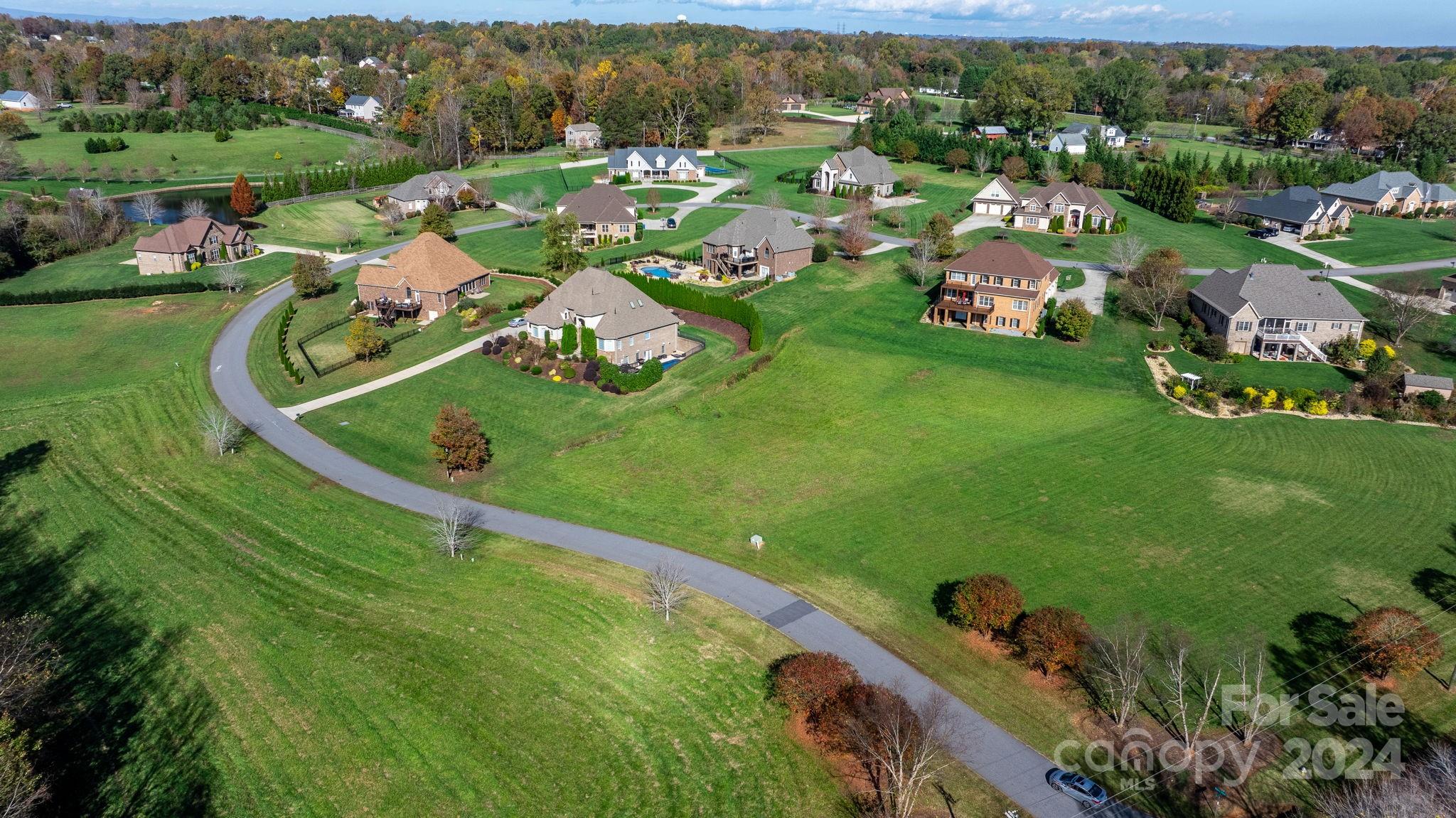 5944 Bakers Point Hickory, NC 28602 - Photo 20 of 22 an aerial view of residential houses with outdoor space and trees