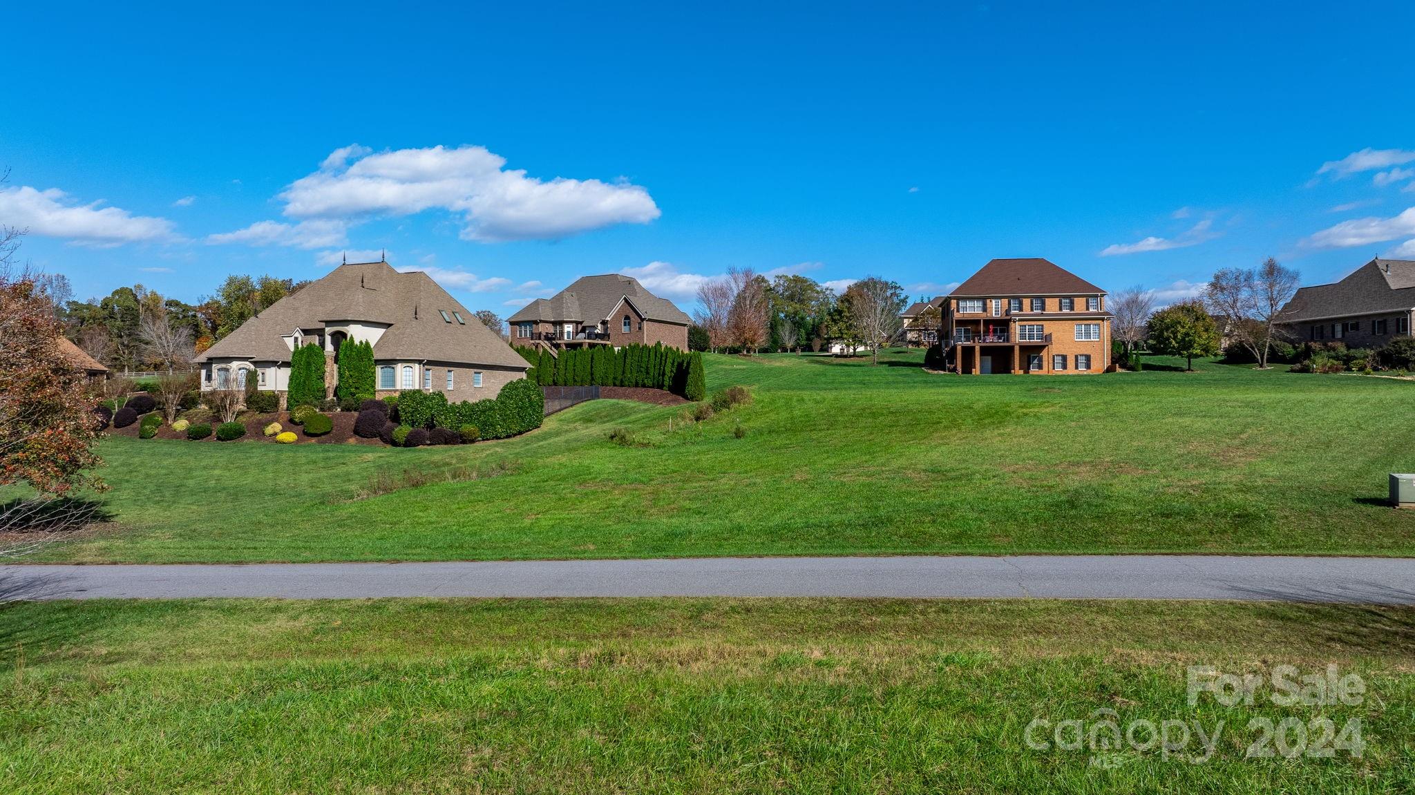 5944 Bakers Point Hickory, NC 28602 - Photo 7 of 22 a view of a large garden with plants and large trees