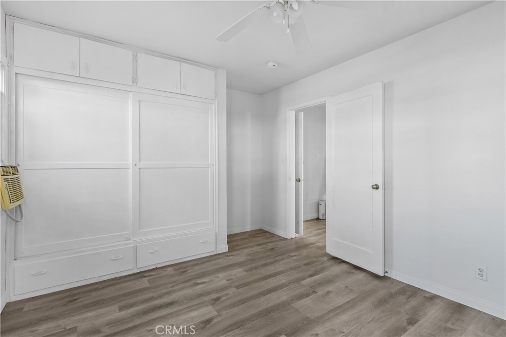 725 Michigan Avenue Beaumont, CA 92223 - Photo 17 of 20 a view of empty room with wooden floor