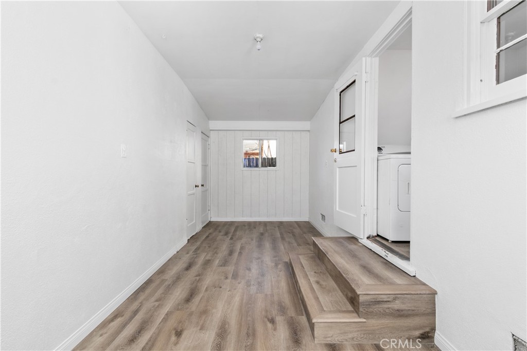 725 Michigan Avenue Beaumont, CA 92223 - Photo 20 of 20 an empty room with wooden floor and windows