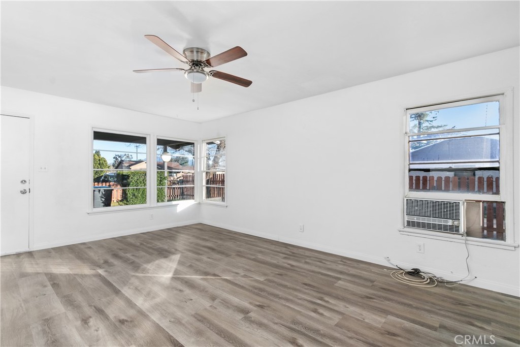 725 Michigan Avenue Beaumont, CA 92223 - Photo 7 of 20 a view of a livingroom with a ceiling fan and window