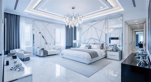 a bedroom with bed and a chandelier