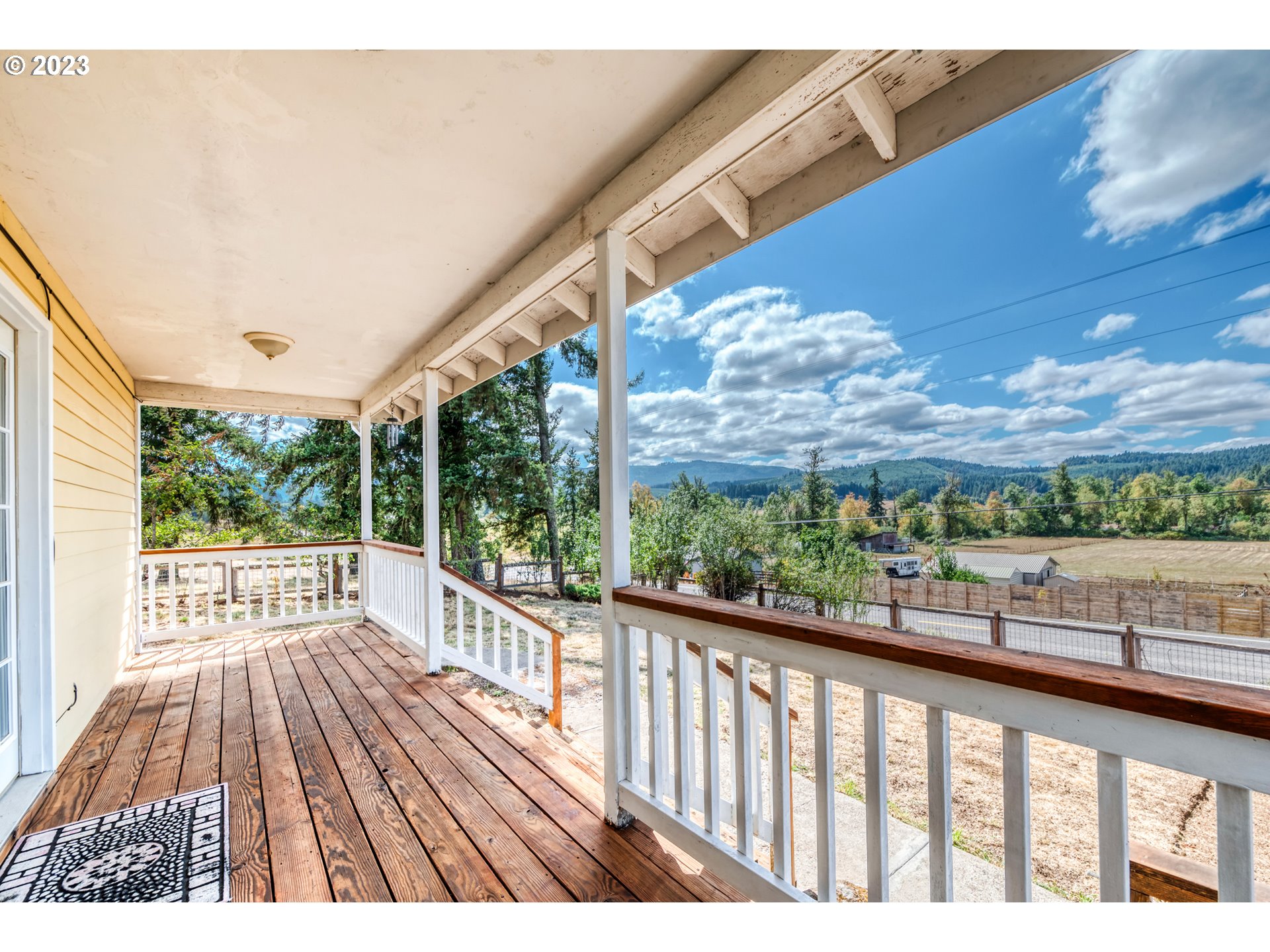 83369 Rattlesnake Road Dexter, OR 97431 - Photo 35 of 44 a view of a porch with wooden floor and outdoor space