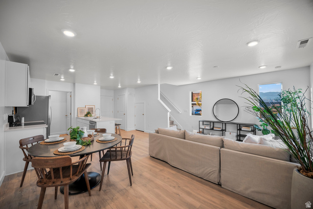 2202 Wolverine Way, Unit 2529 Washington, UT 84780 - Photo 2 of 27 Open-concept living space featuring wood-finish flooring, recessed lighting, and white walls