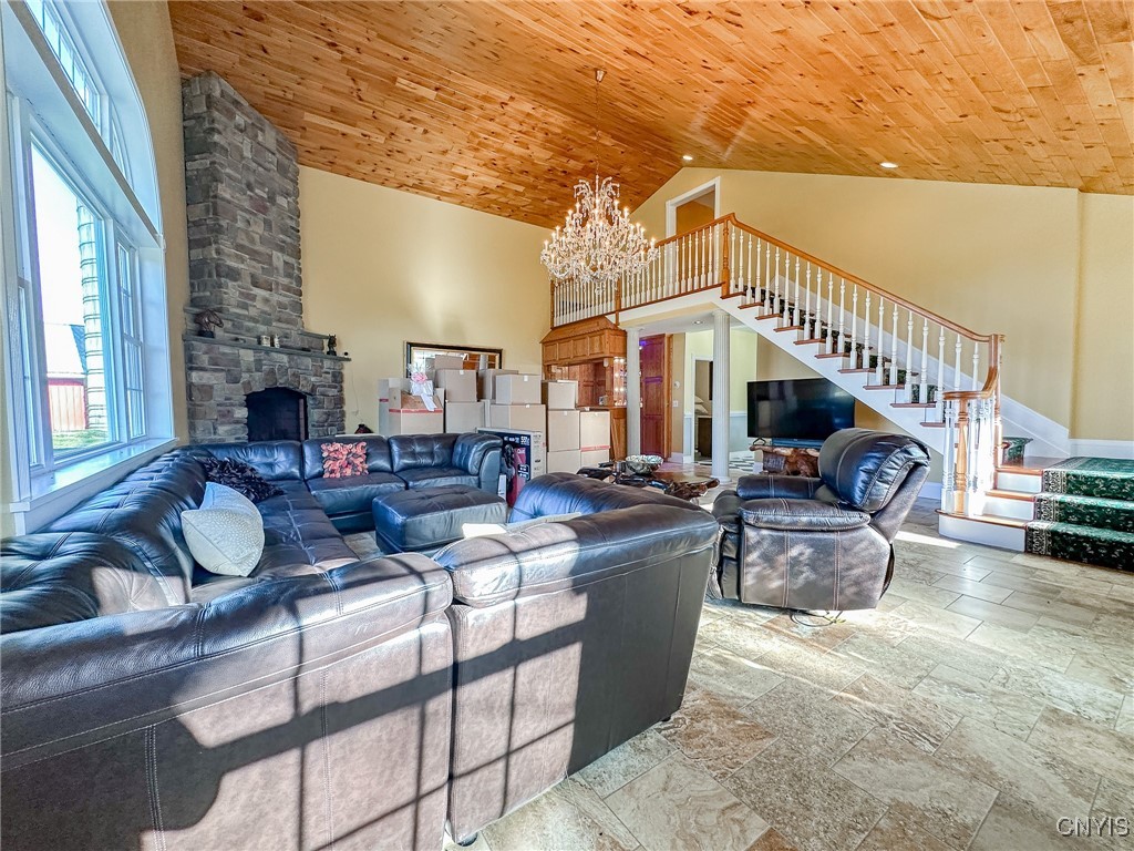 4099 Piety Ridge Road Marathon, NY 13803 - Photo 9 of 26 Grand main room with fireplace and staircase (excu