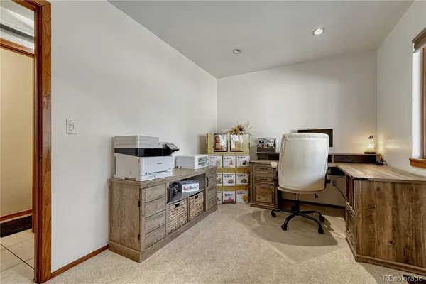 a view of a workspace with furniture