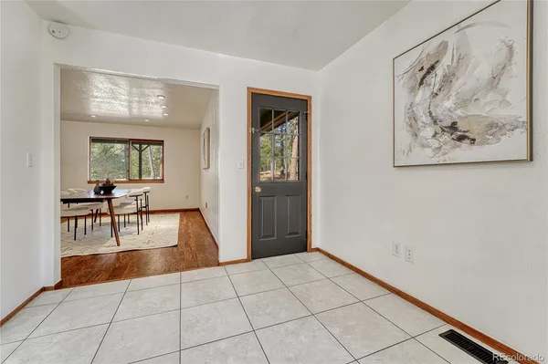 a view of a livingroom with furniture and window