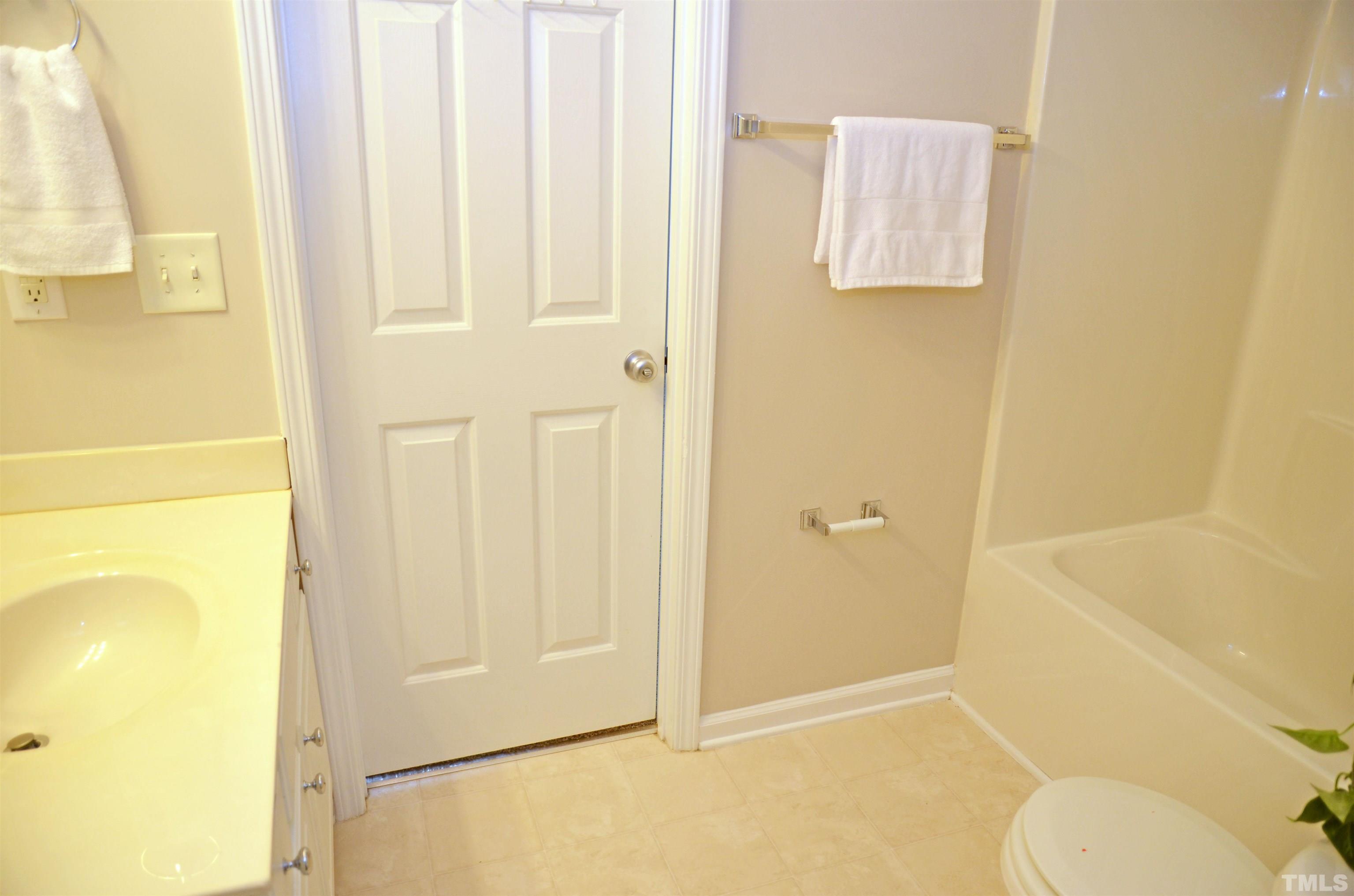 8428 Aztec Dawn Court Raleigh, NC 27613 - Photo 15 of 33 a bathroom with a granite countertop shower and a toilet
