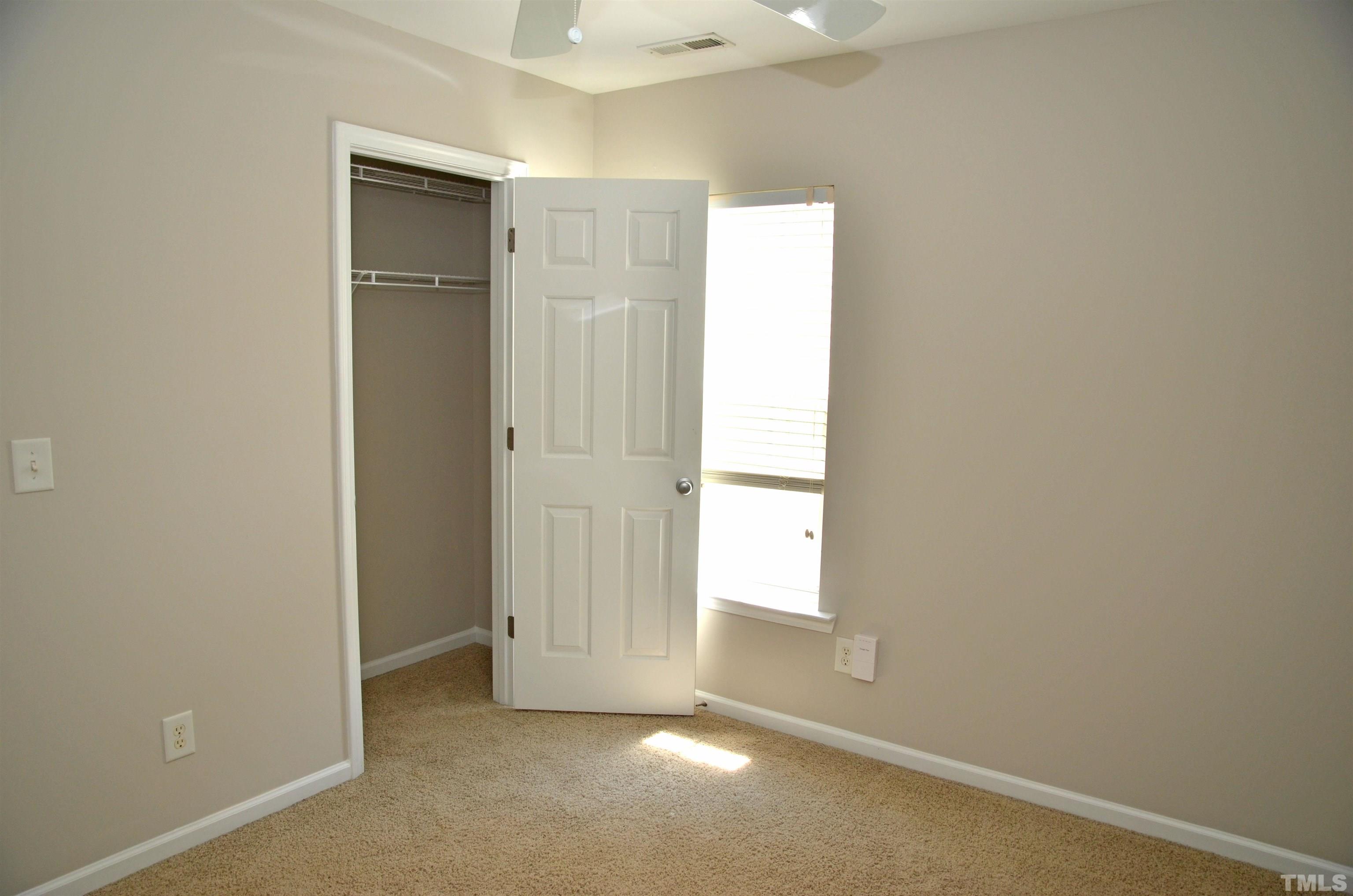 8428 Aztec Dawn Court Raleigh, NC 27613 - Photo 4 of 33 an empty room with windows