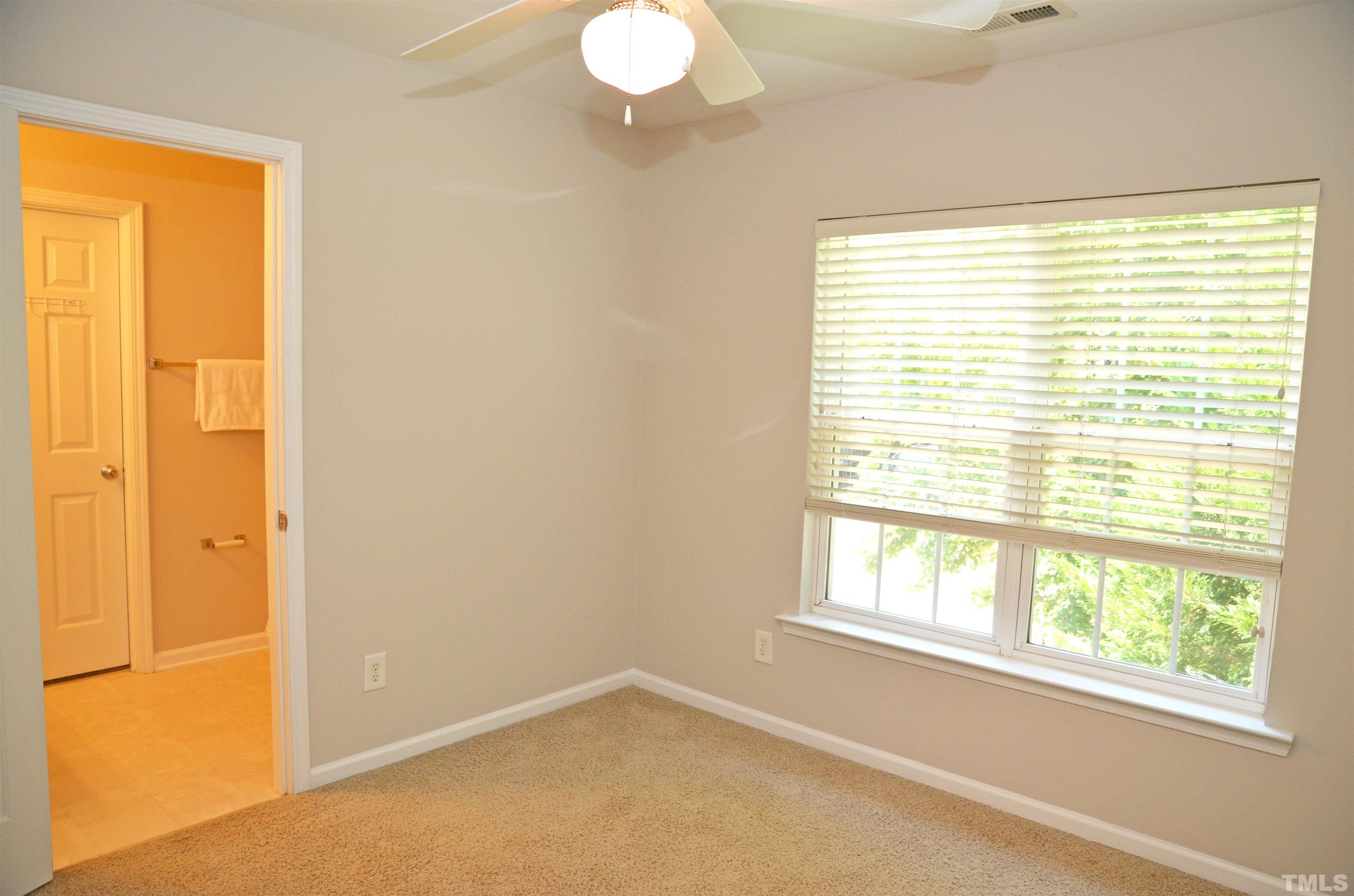 8428 Aztec Dawn Court Raleigh, NC 27613 - Photo 5 of 33 a view of an empty room with a window