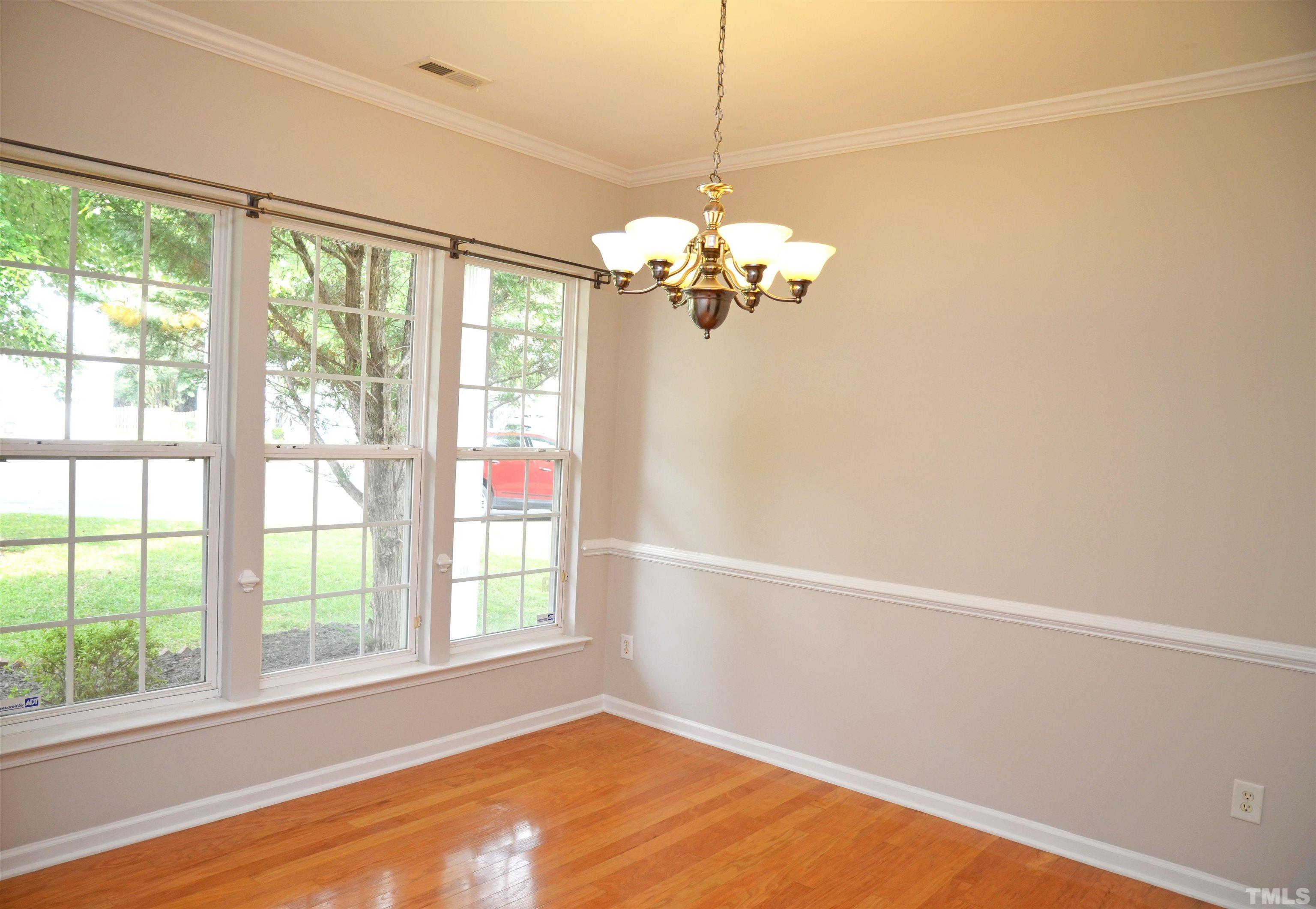 8428 Aztec Dawn Court Raleigh, NC 27613 - Photo 7 of 33 a view of a room with a large window