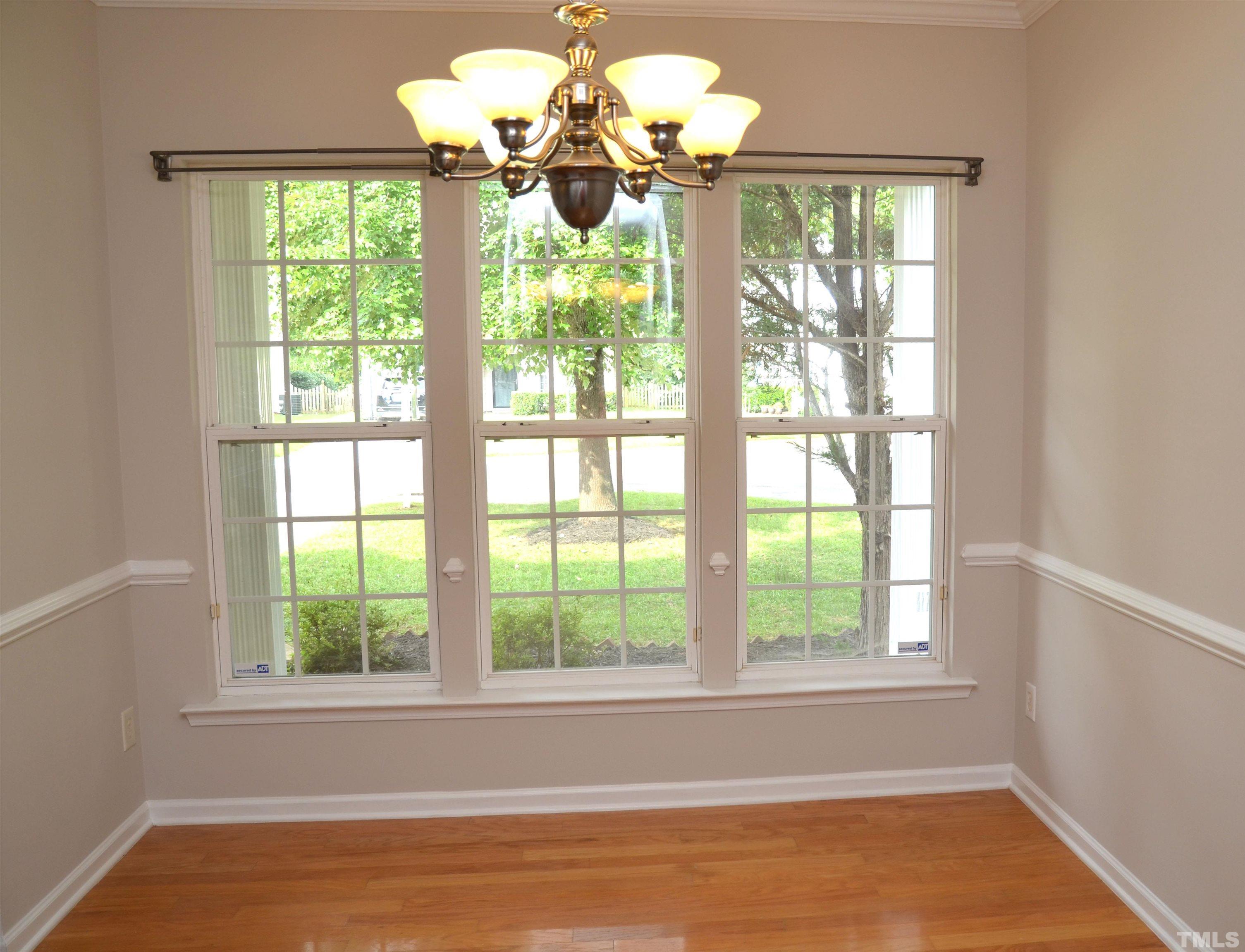 8428 Aztec Dawn Court Raleigh, NC 27613 - Photo 8 of 33 a view of a windows and chandelier in a room