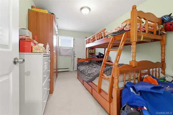 a bathroom with a toilet sink and shower